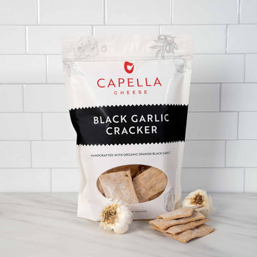 Bag of black garlic crackers made by Capella Cheese