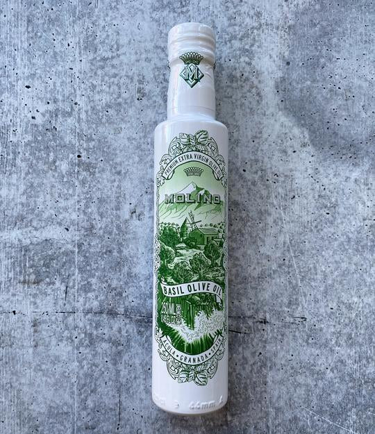 Bottle of Molino Basil Olive Oil on stone background