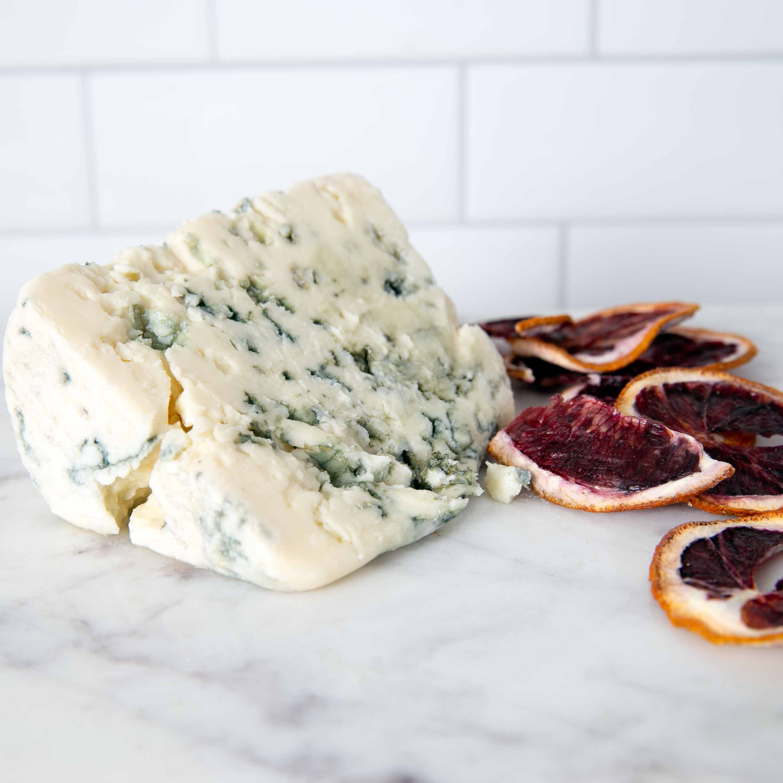Roquefort AOP blue cheese on marble surface